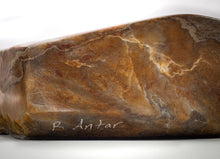 BOWL CARVED OUT OF STONE